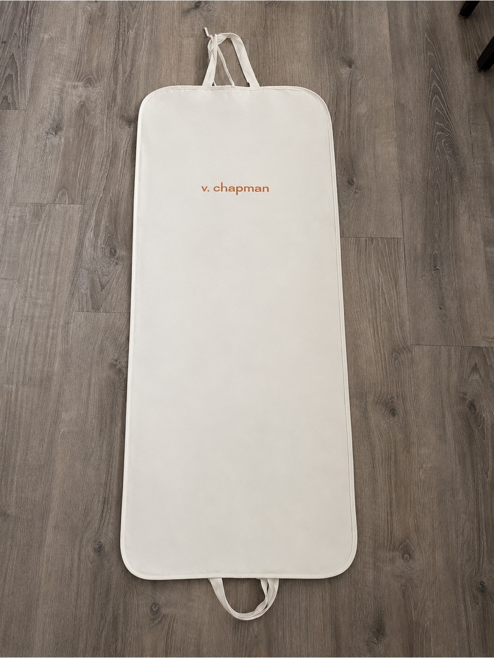 V. Chapman Garment Bag with Bow Tie Closures in Cream